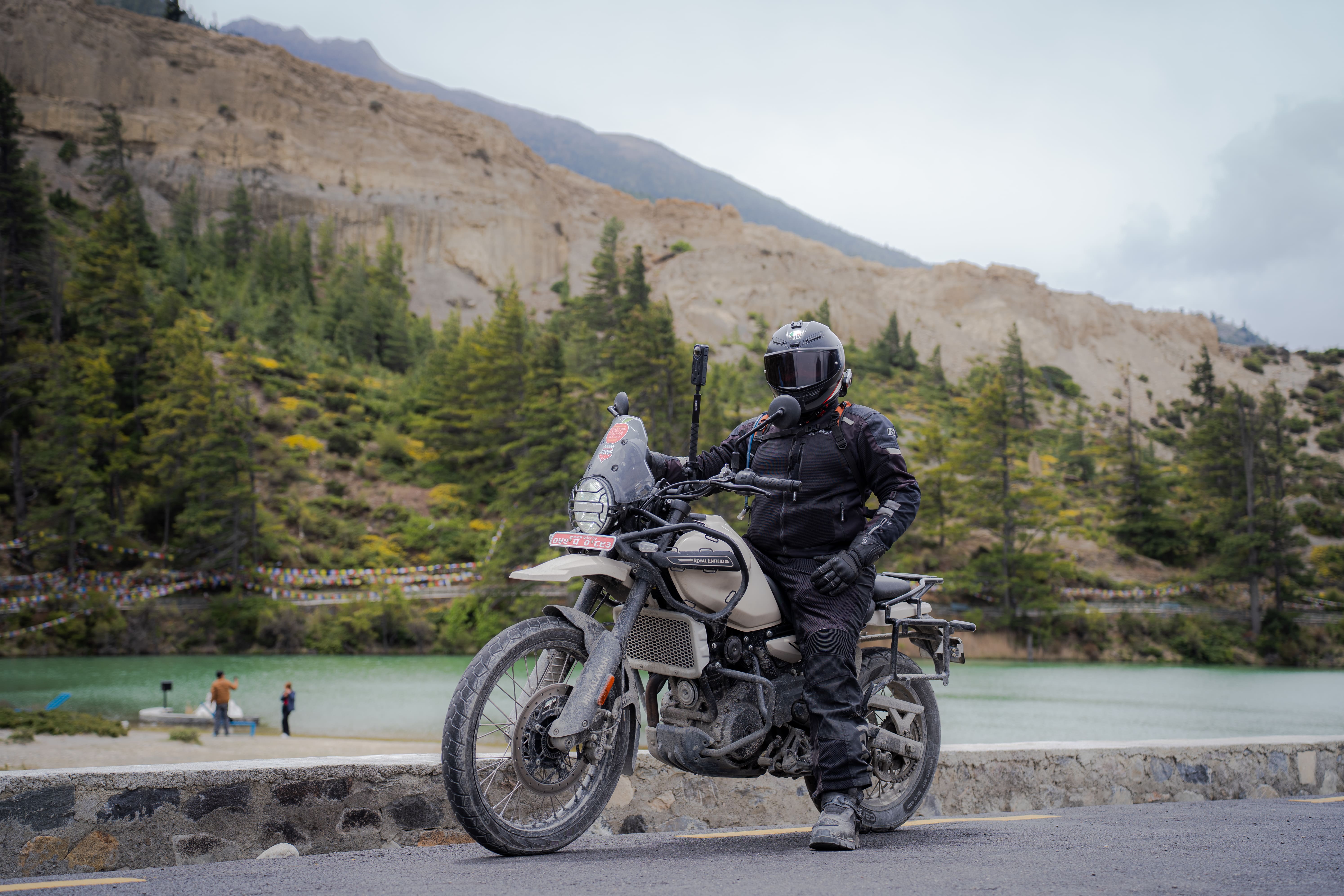 202605241920_Motorcycle rider in front of dhumba lake.jpg